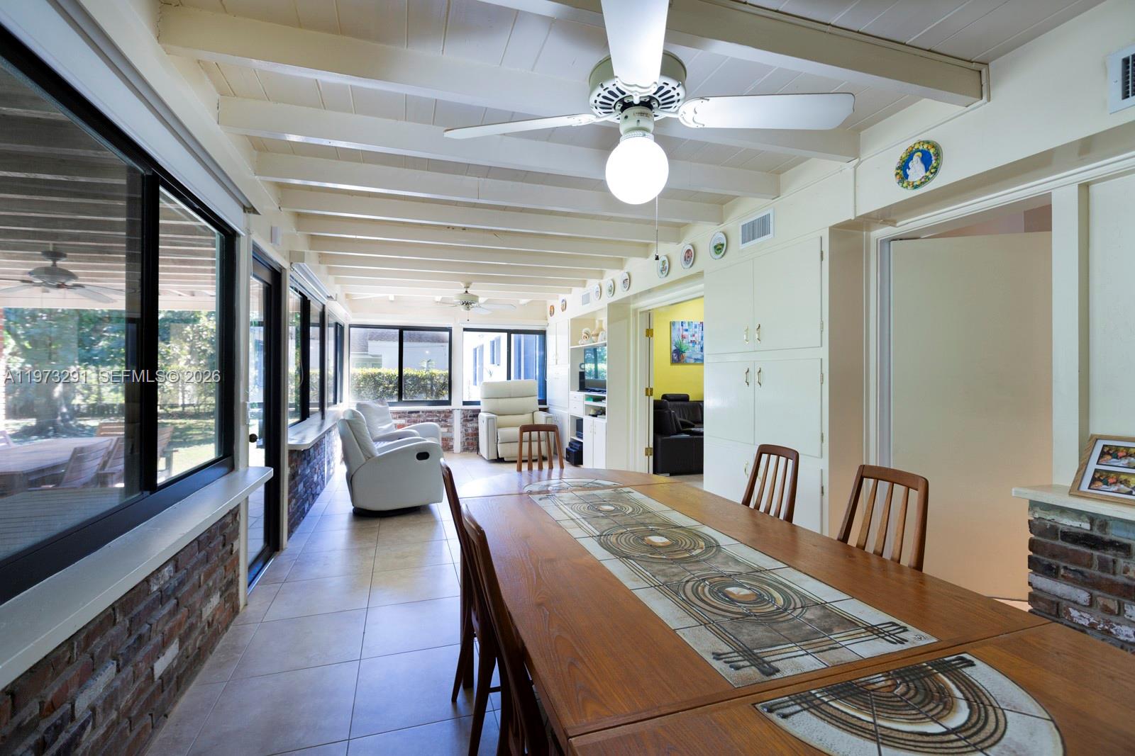 3721 Southwest 58th Avenue Miami, FL 33155 - Photo 13 of 23 a view of a dining room with furniture