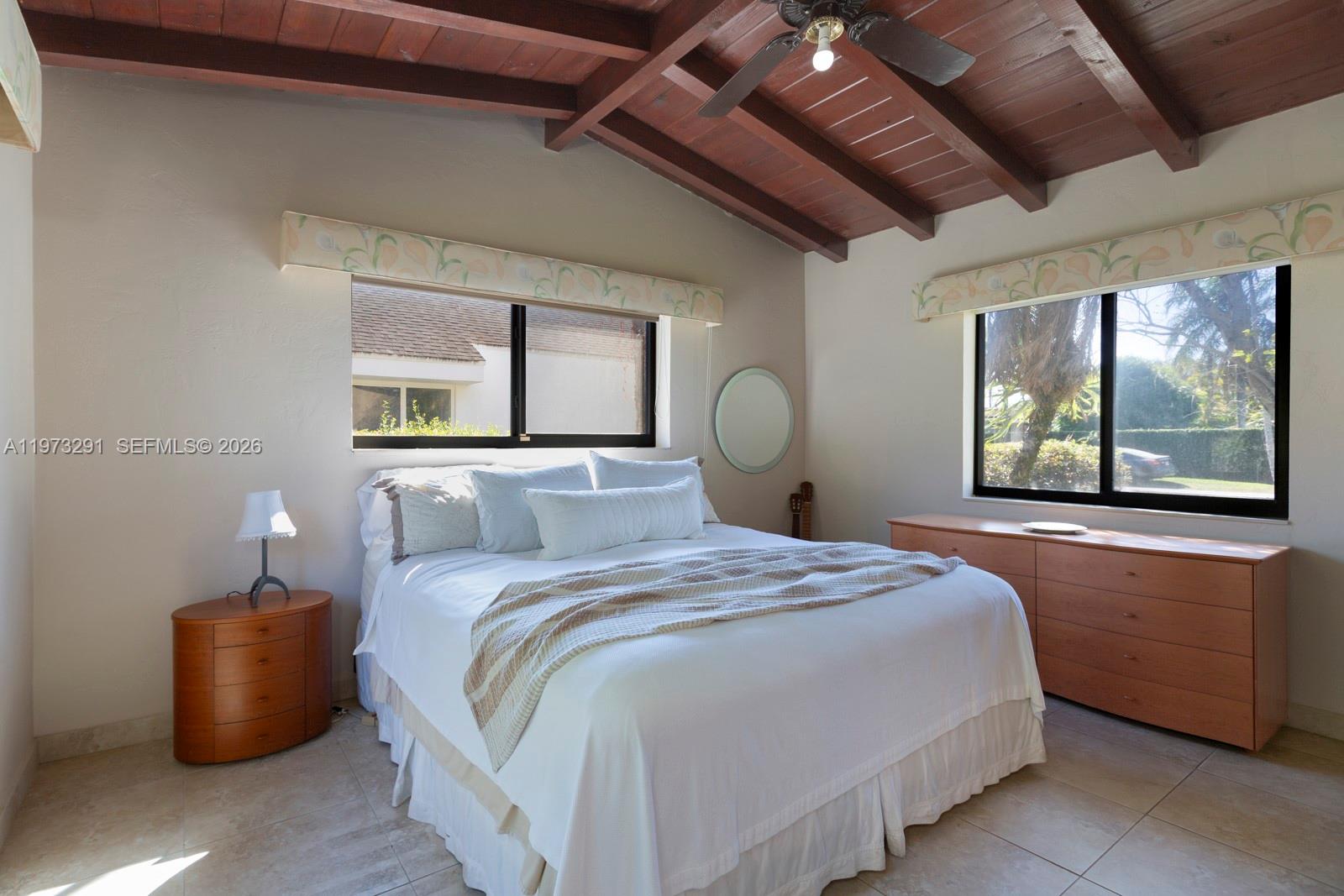 3721 Southwest 58th Avenue Miami, FL 33155 - Photo 15 of 23 a bedroom with a large bed and a large window