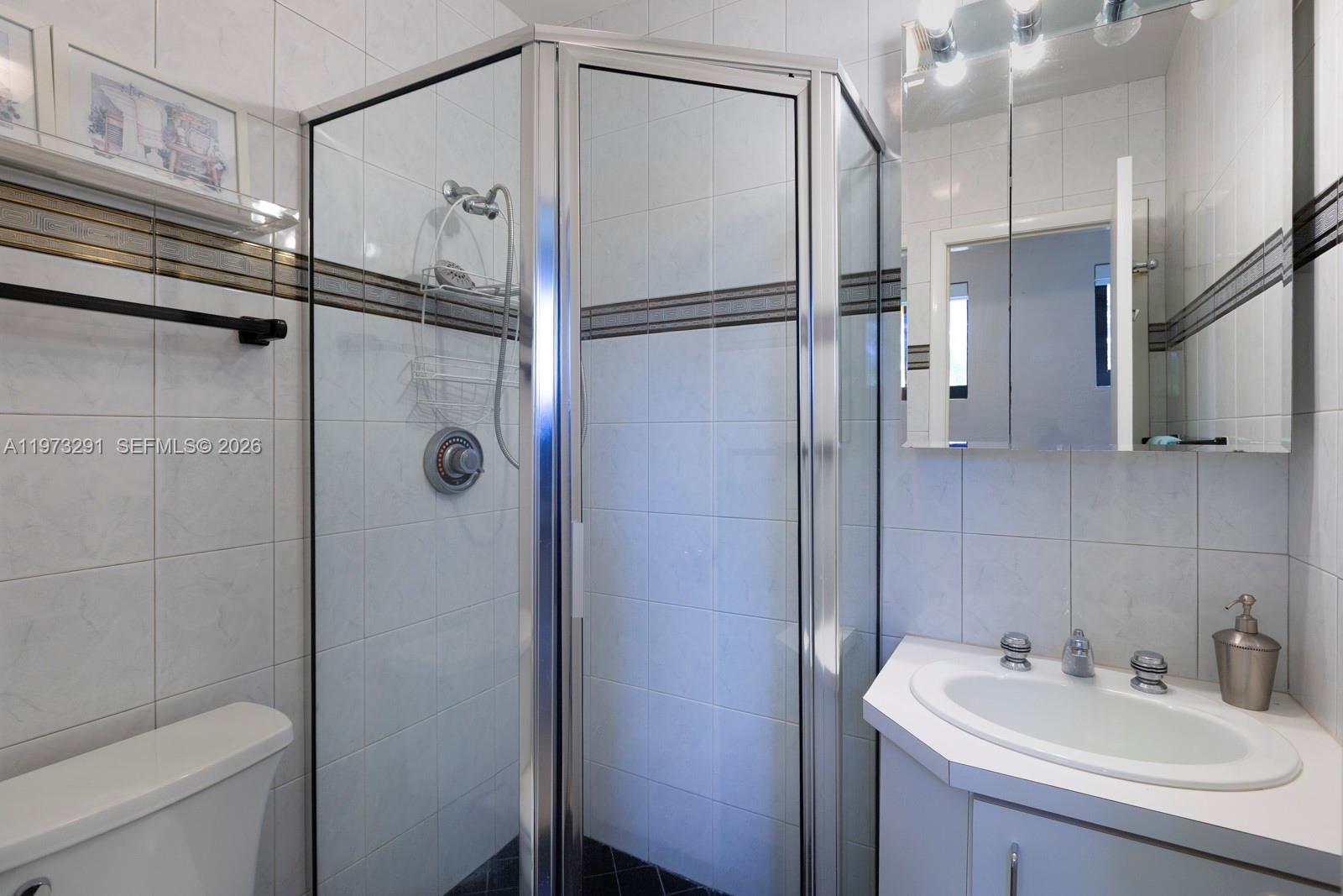 3721 Southwest 58th Avenue Miami, FL 33155 - Photo 19 of 23 a bathroom with a sink toilet and shower