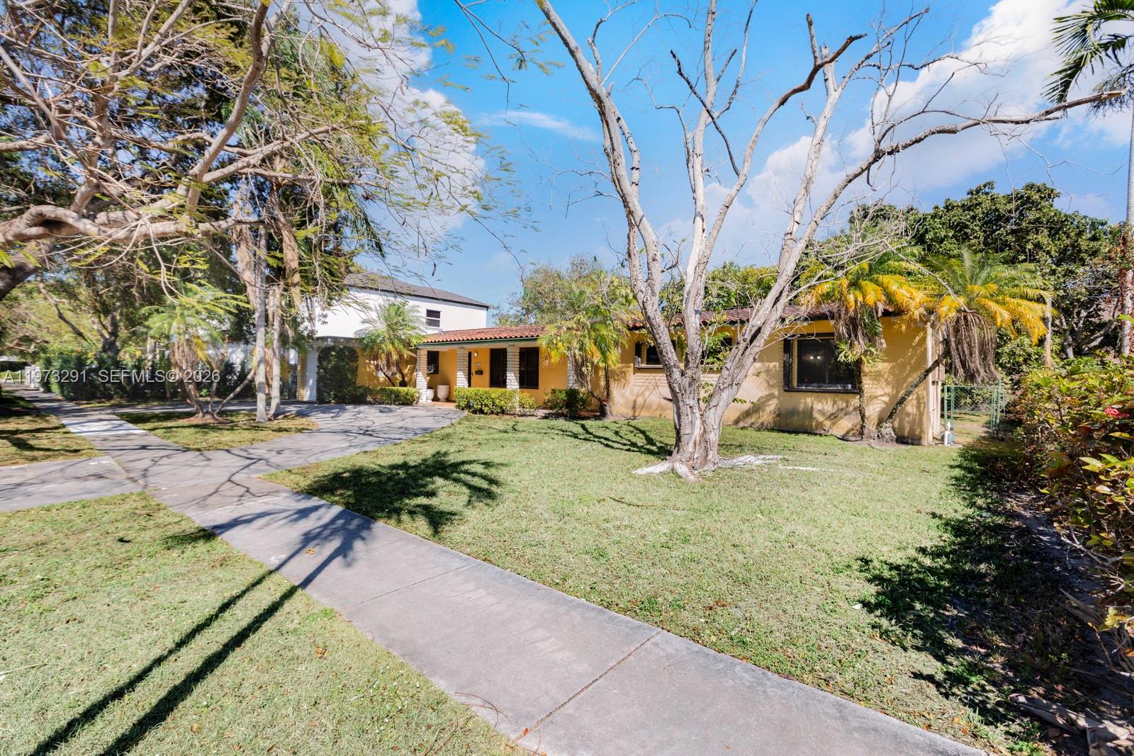 3721 Southwest 58th Avenue Miami, FL 33155 - Photo 6 of 23 a front view of a house with garden