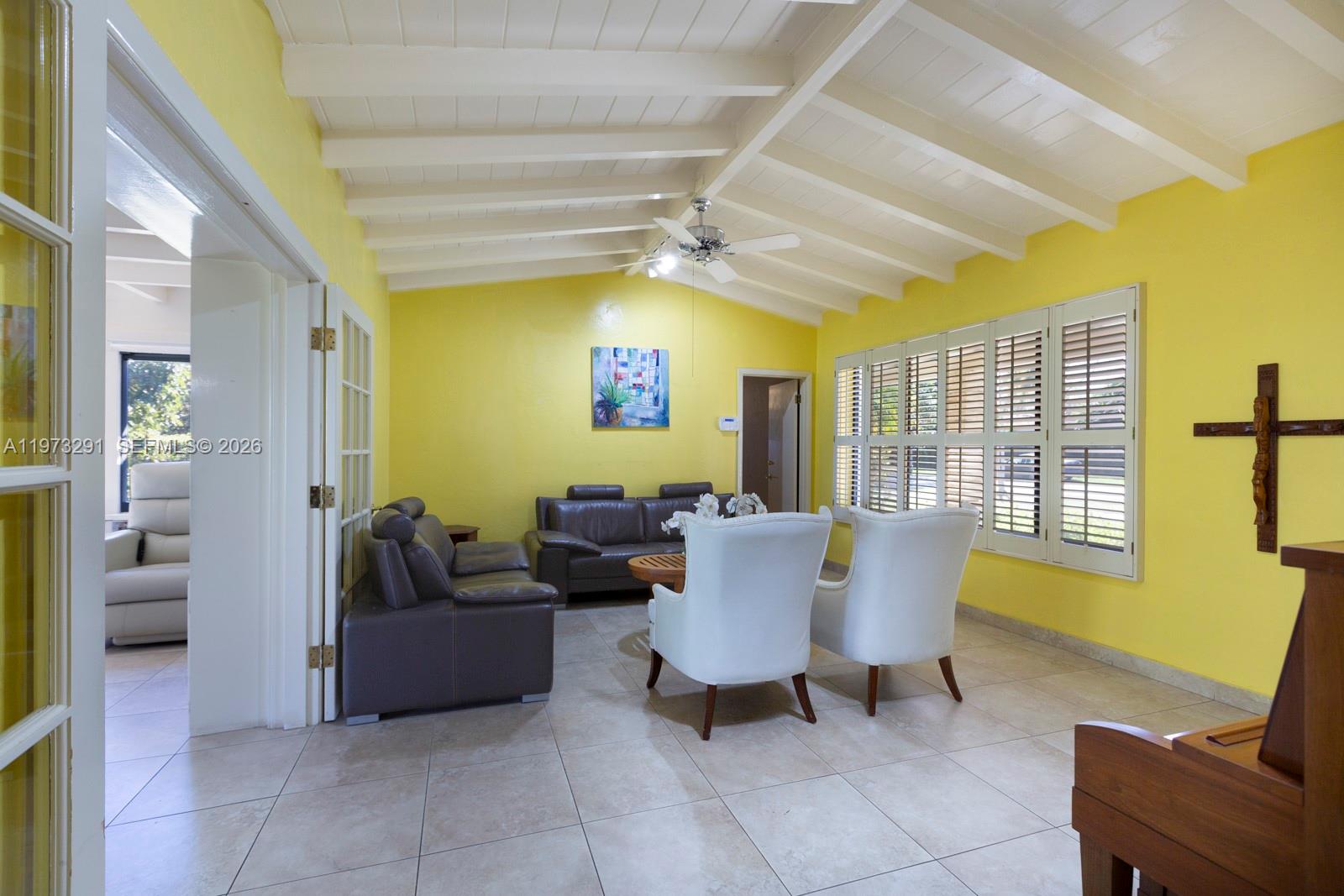 3721 Southwest 58th Avenue Miami, FL 33155 - Photo 7 of 23 a living room with furniture and a table