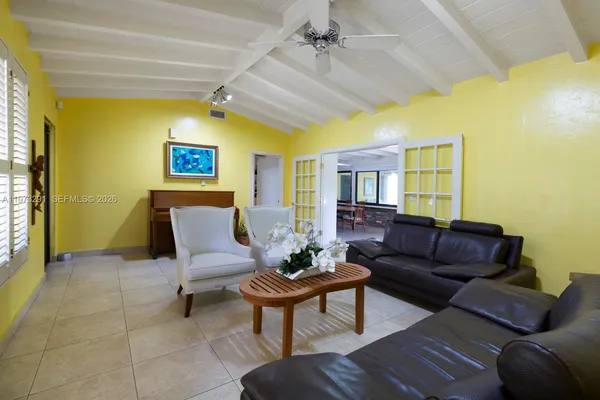 a living room with furniture and a window