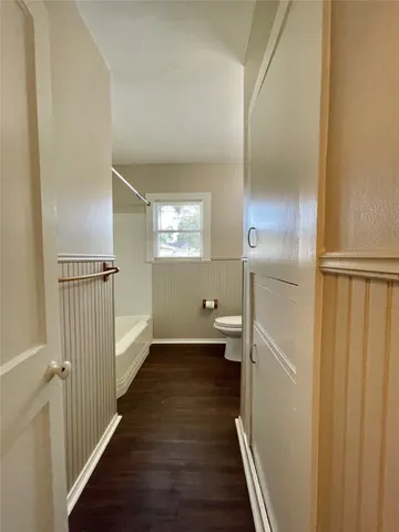 a view of a bathroom from the hallway