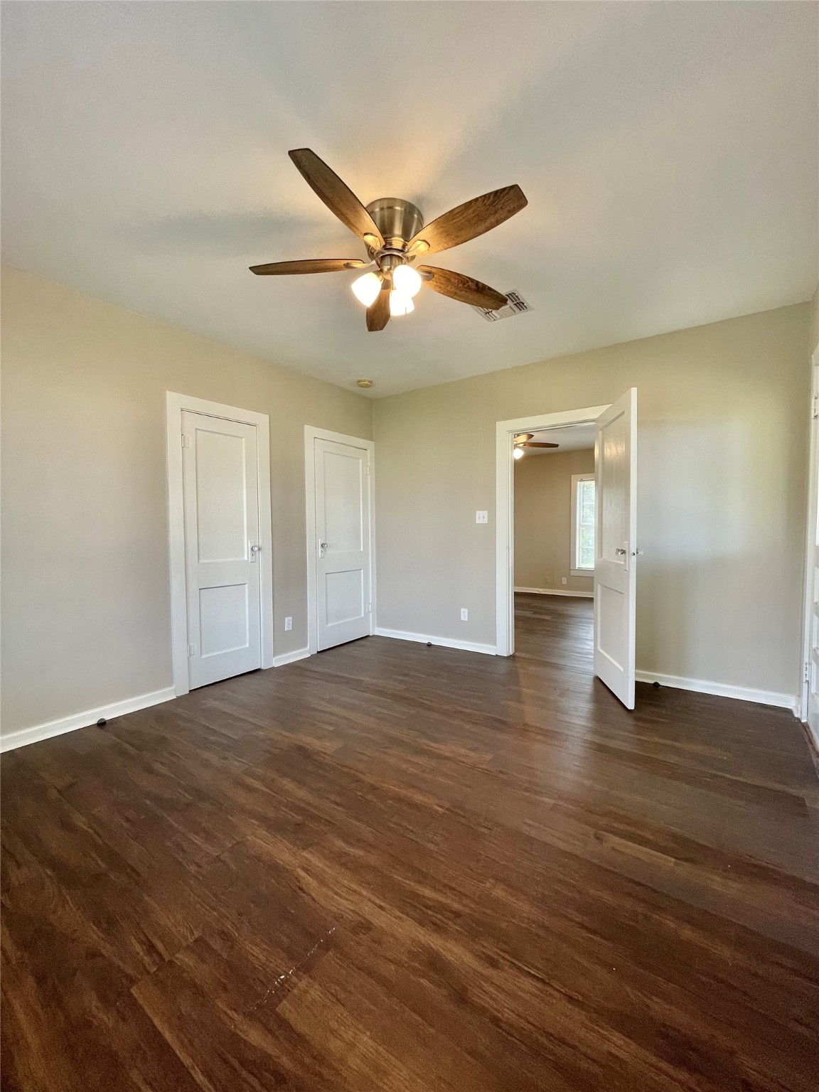 813 Nursery Street Clute, TX 77531 - Photo 14 of 24 a view of empty room with wooden floor and fan