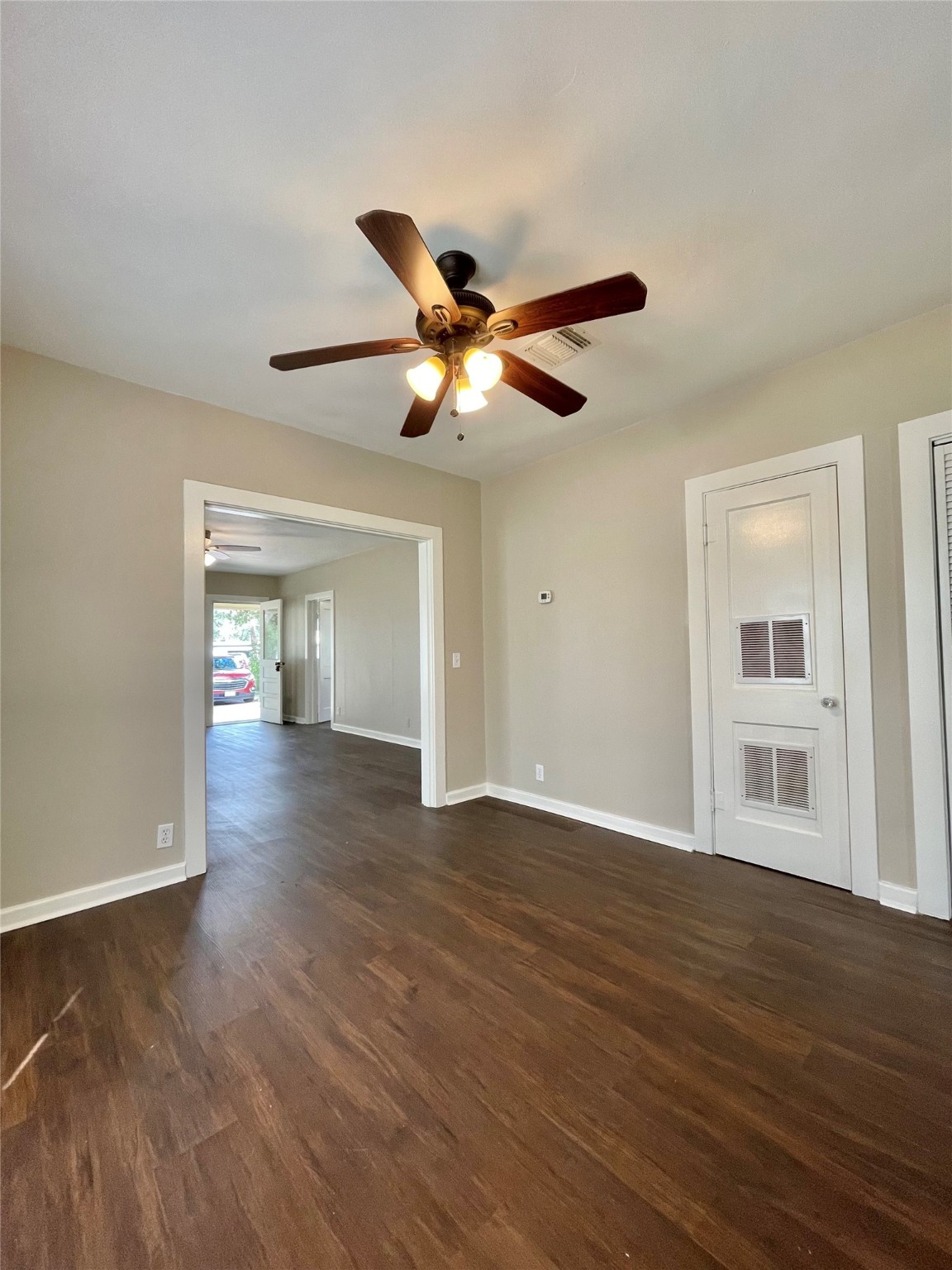 813 Nursery Street Clute, TX 77531 - Photo 17 of 24 a view of an empty room with window and wooden floor