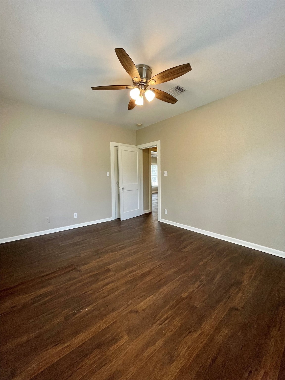 813 Nursery Street Clute, TX 77531 - Photo 8 of 24 a view of an empty room with wooden floor