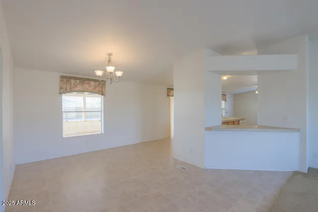 a kitchen with granite countertop cabinets stainless steel appliances and a counter space