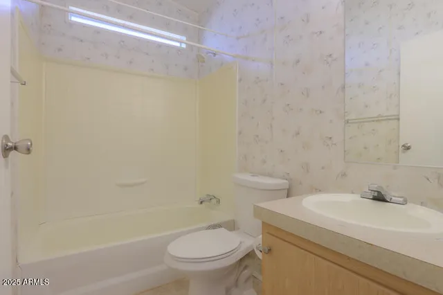 a view of an empty room with a balcony