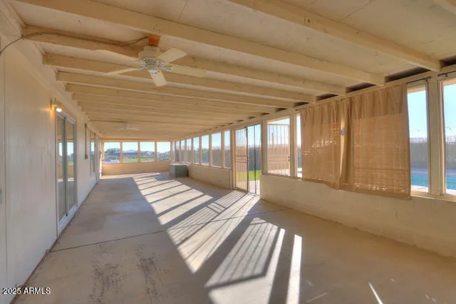 a view of a house with a yard and sitting area
