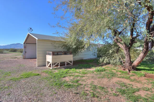 an aerial view of a houses with a yard
