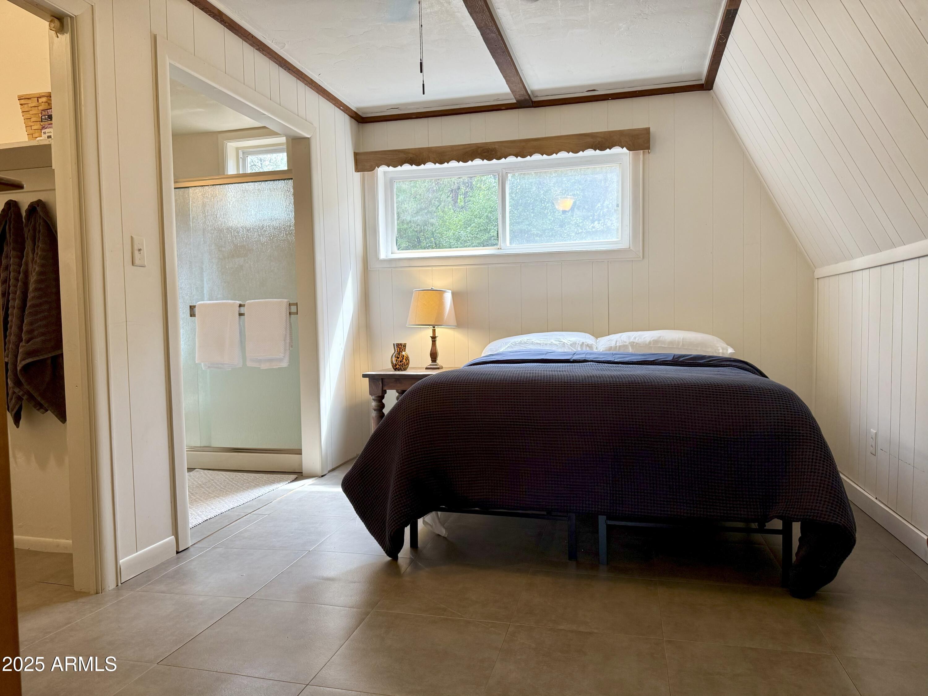 3868 Bloody Basin Road Pine, AZ 85544 - Photo 9 of 17 a bedroom with a bed and a window