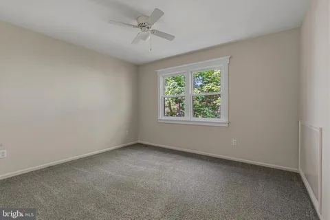 a view of an empty room and closet area