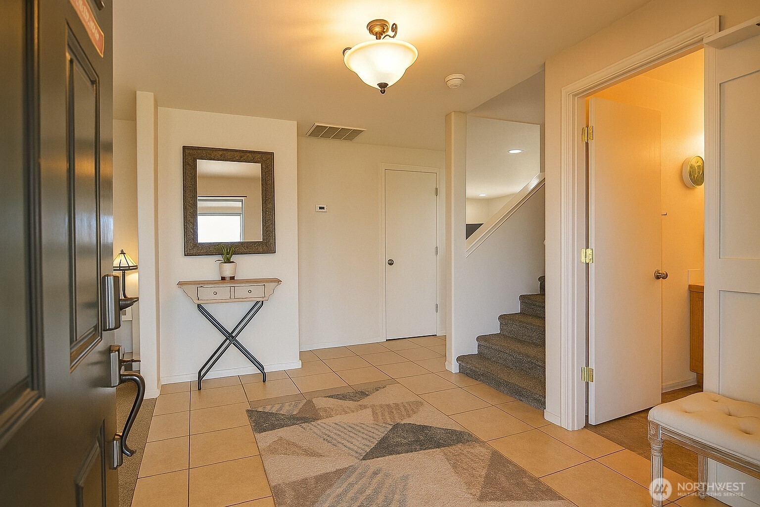 526 Monarch Street Moses Lake, WA 98837 - Photo 12 of 38 a view of a livingroom with wooden floor and a bathroom