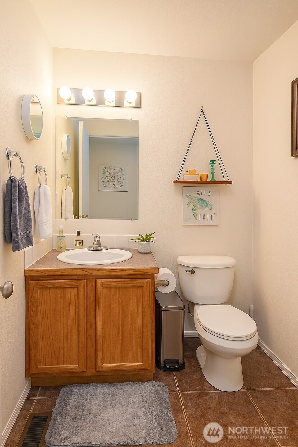 526 Monarch Street Moses Lake, WA 98837 - Photo 13 of 38 a bathroom with a toilet sink and mirror