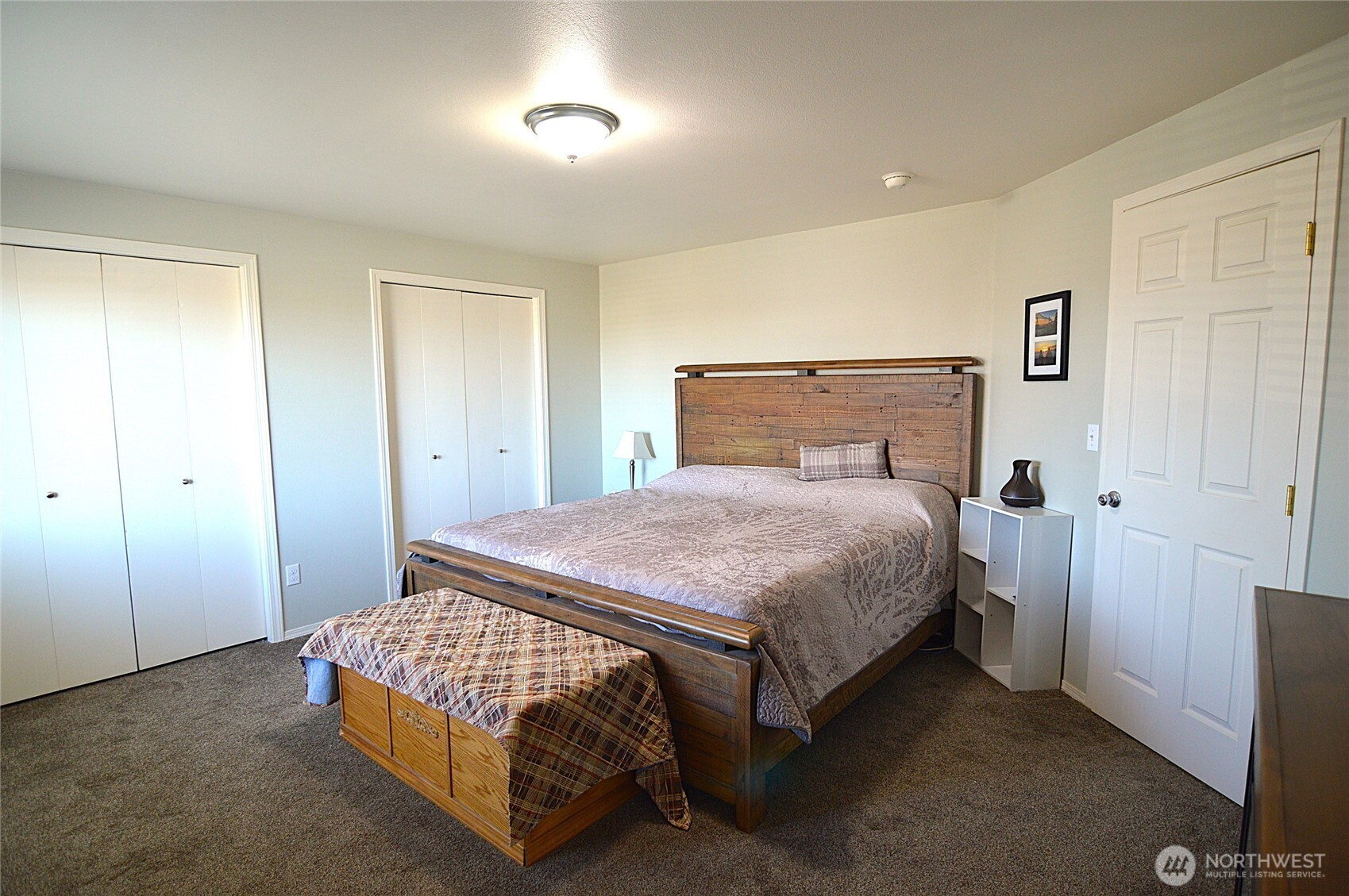 526 Monarch Street Moses Lake, WA 98837 - Photo 25 of 38 a bedroom with a bed and a cabinets