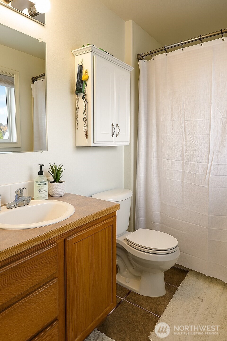 526 Monarch Street Moses Lake, WA 98837 - Photo 30 of 38 a bathroom with a sink and a mirror