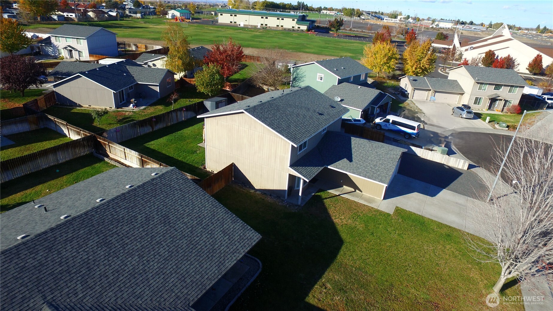 526 Monarch Street Moses Lake, WA 98837 - Photo 36 of 38 an aerial view of a house with a garden and lake view