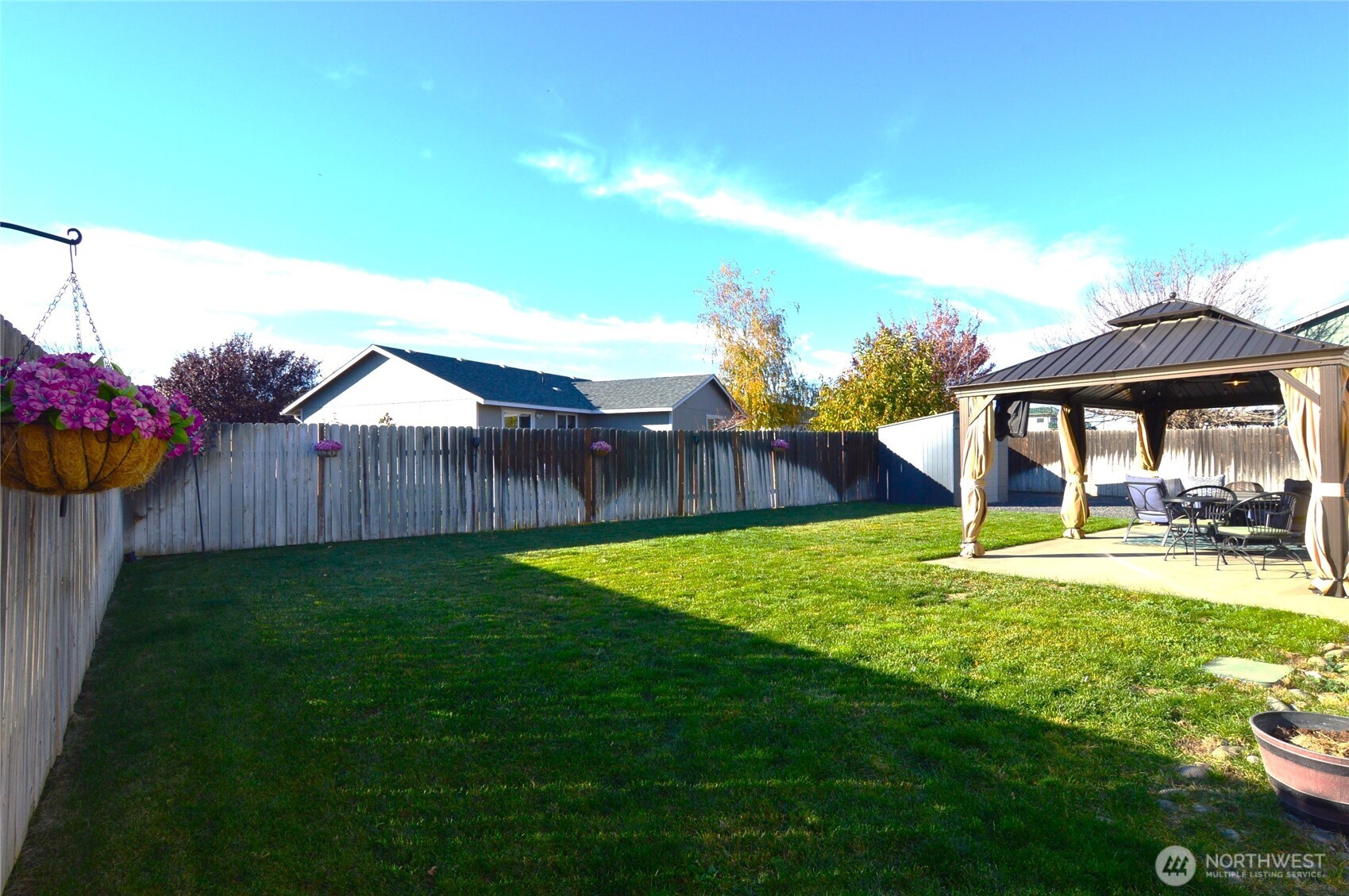 526 Monarch Street Moses Lake, WA 98837 - Photo 6 of 38 a view of a backyard with sitting area