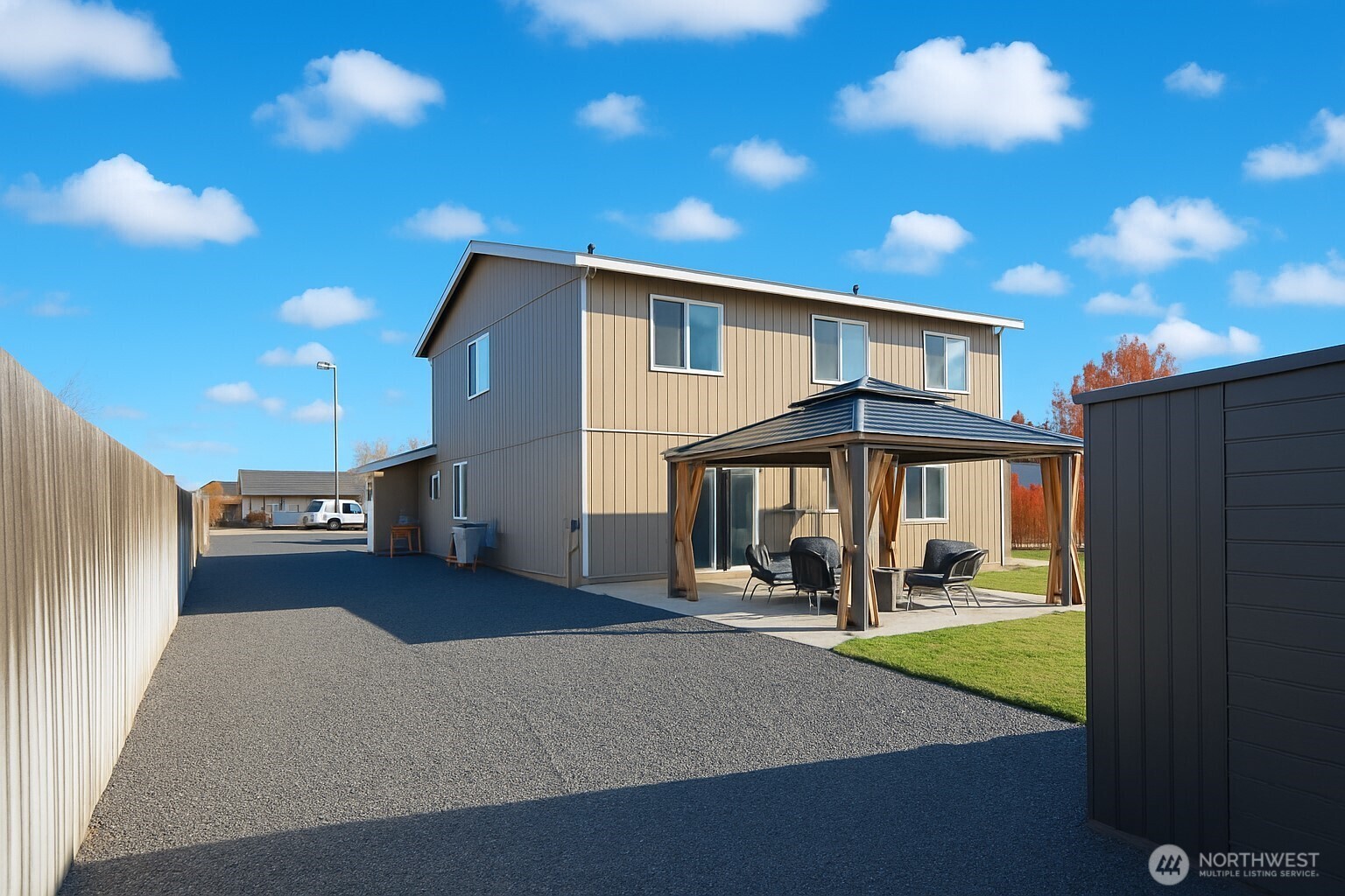 526 Monarch Street Moses Lake, WA 98837 - Photo 7 of 38 a front view of a house with a yard and garage