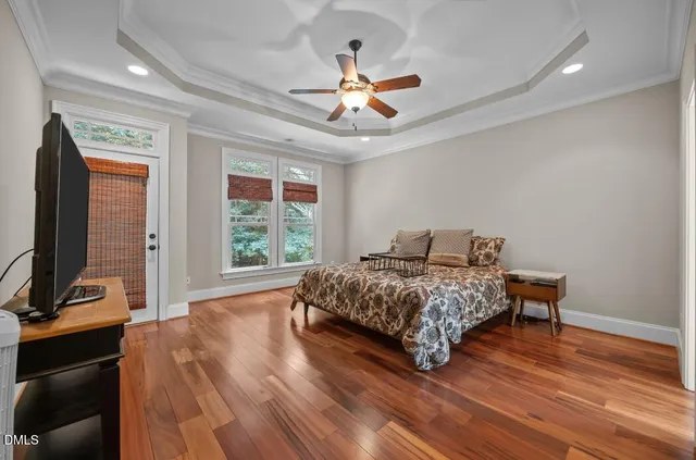 a bedroom with a bed and a flat tv screen