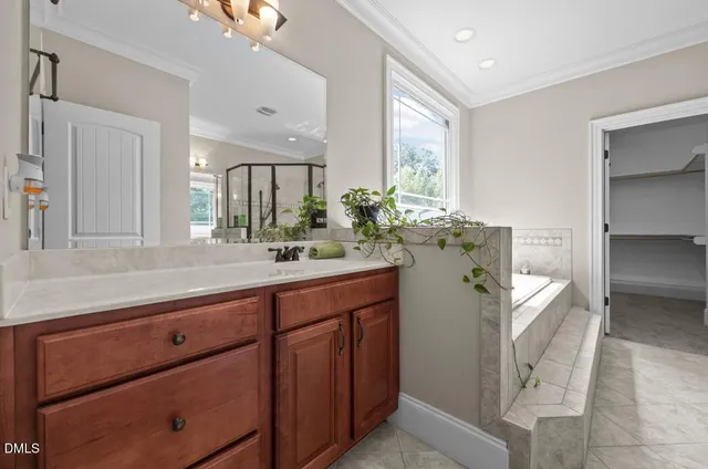 a bathroom with a double vanity sink and mirror