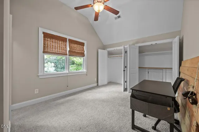 a view of a room with workspace and a window