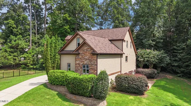 an aerial view of a house with a garden and plants