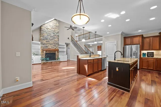 a view of a kitchen with furniture and wooden floor