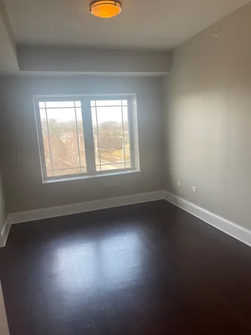 a bathroom with a granite countertop sink and a toilet