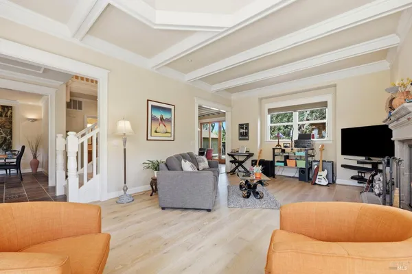 a kitchen that has a stove a table and chairs in it