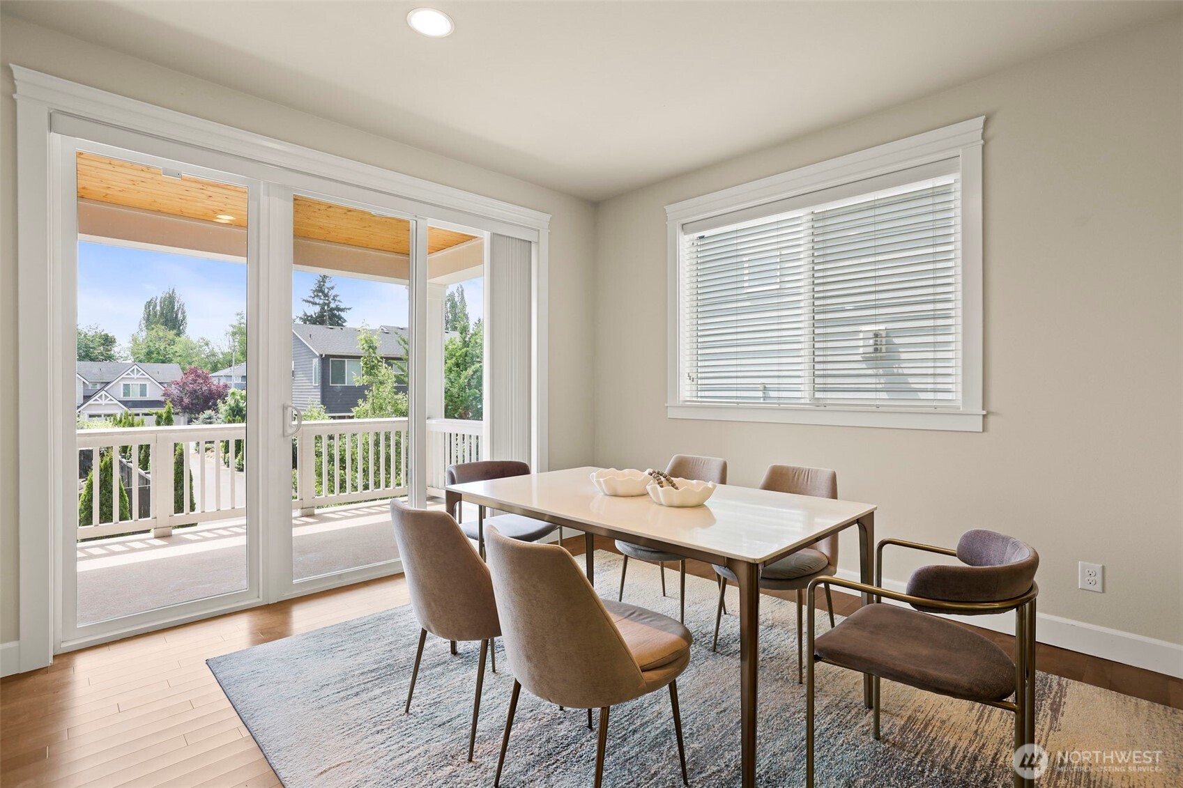 29 242nd Street Southeast Bothell, WA 98021 - Photo 10 of 40 a dining room with wooden floor a chandelier a wooden table and chairs