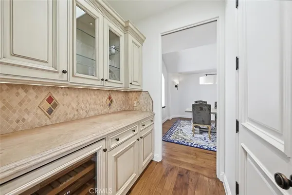 a view of a kitchen cabinets and wooden floor