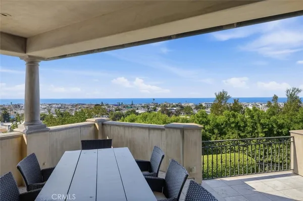 a view of roof deck with chairs