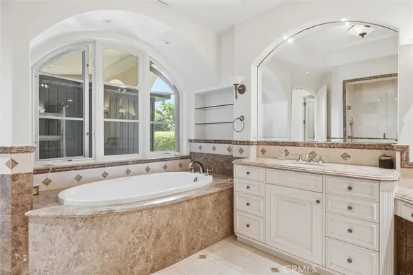 a bath room with a sink and a mirror