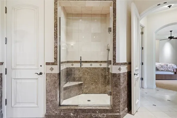 a bathroom with a granite countertop shower mirror and a sink