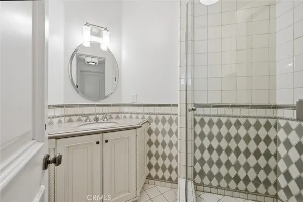 a bathroom with a mirror and a shower