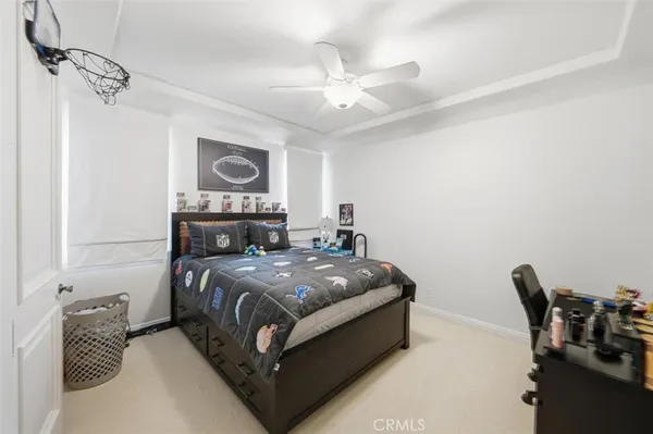 a bedroom with a bed and a chair