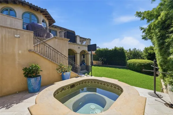 a view of a house with a yard and plants