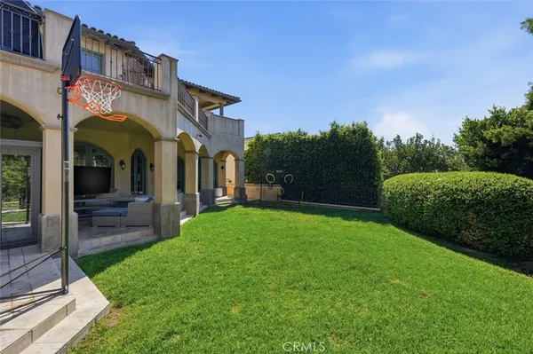 a front view of a house with garden and patio