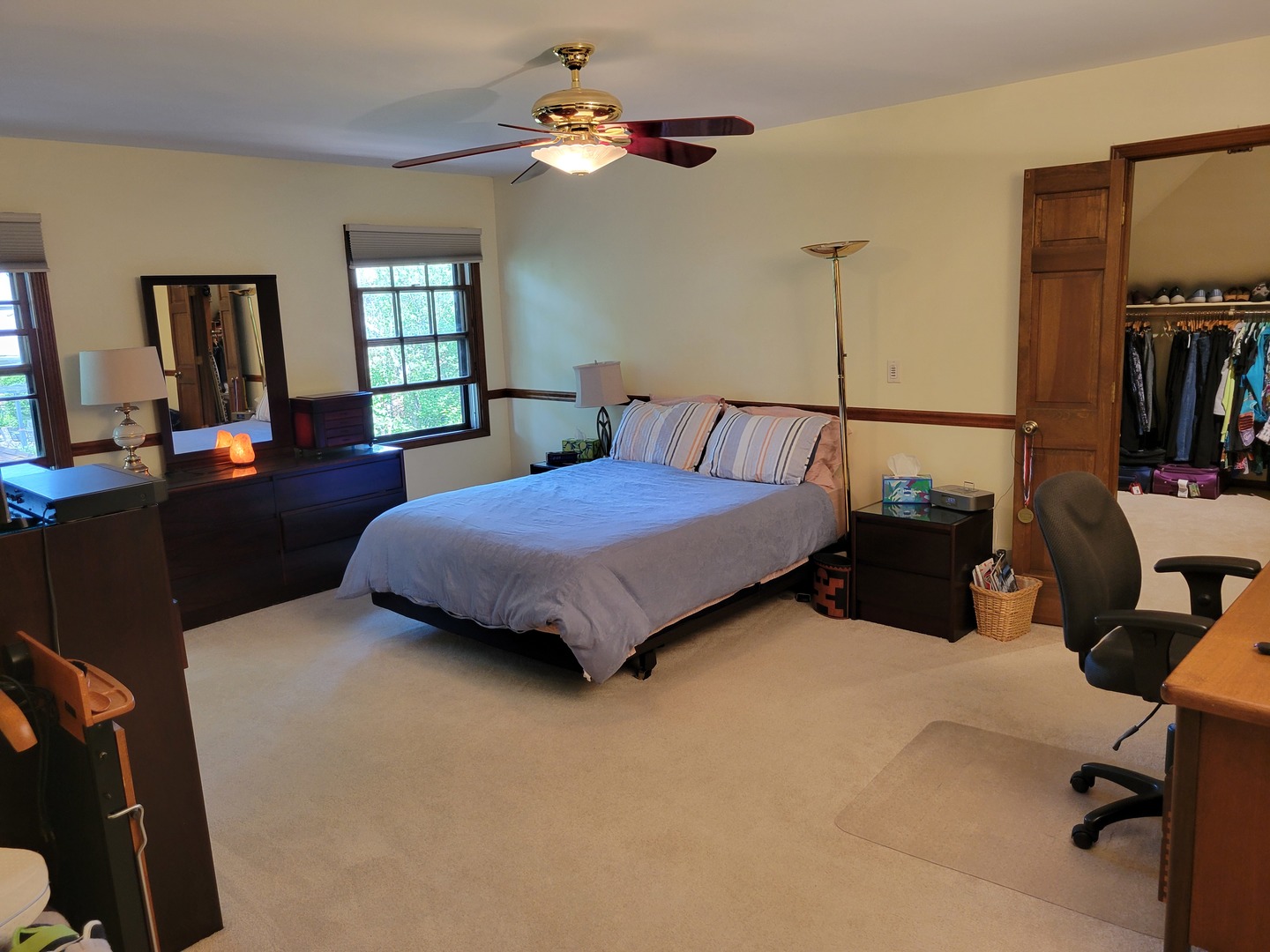 1263 Bainbridge Drive Naperville, IL 60563 - Photo 12 of 31 a bedroom with a bed a bookshelf and a chandelier