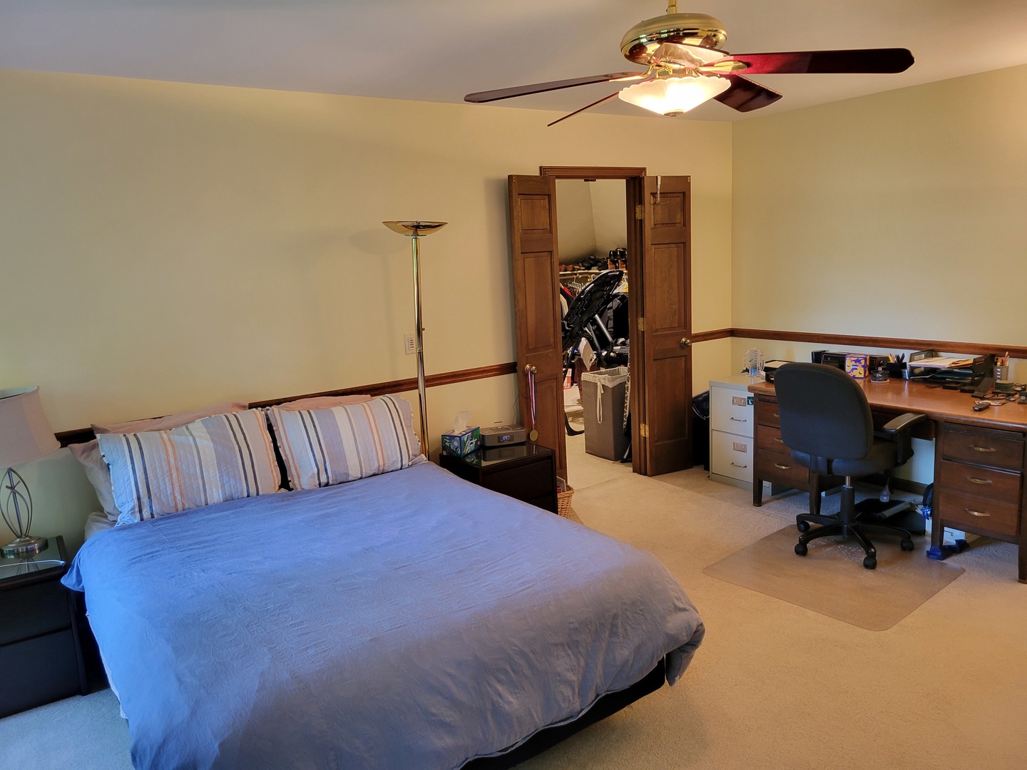 1263 Bainbridge Drive Naperville, IL 60563 - Photo 13 of 31 a bed room with a bed and a chandelier