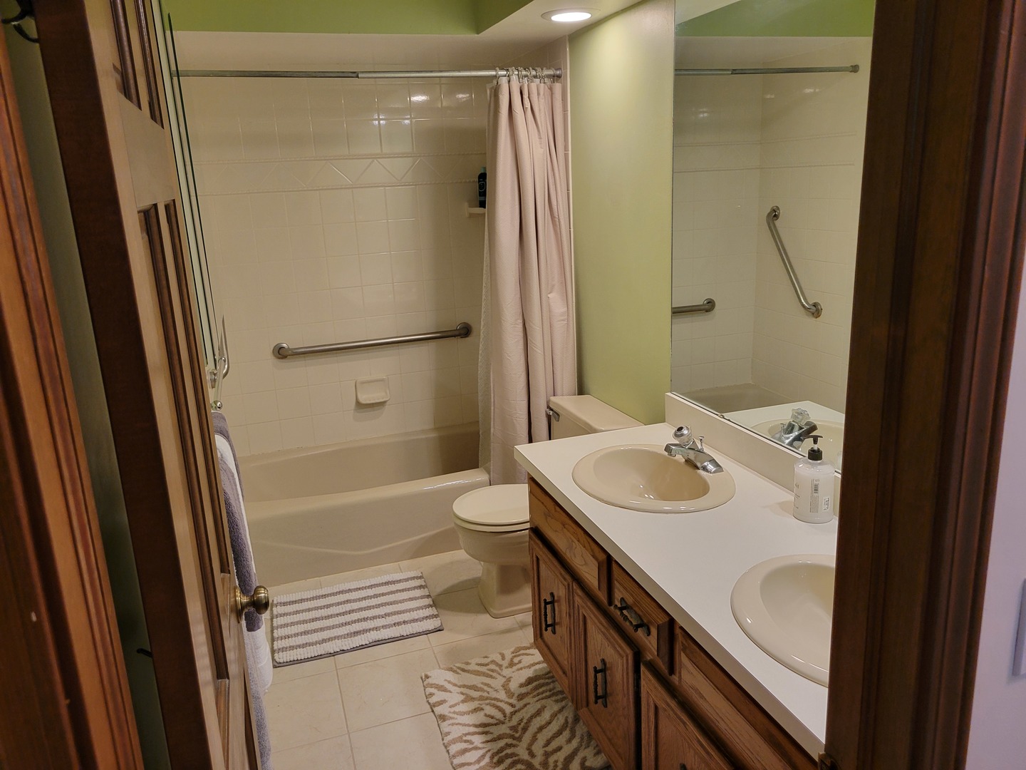 1263 Bainbridge Drive Naperville, IL 60563 - Photo 20 of 31 a bathroom with a sink a toilet a mirror and shower