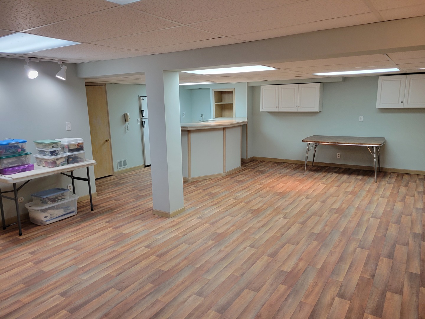 1263 Bainbridge Drive Naperville, IL 60563 - Photo 25 of 31 a room with wooden floor and furniture