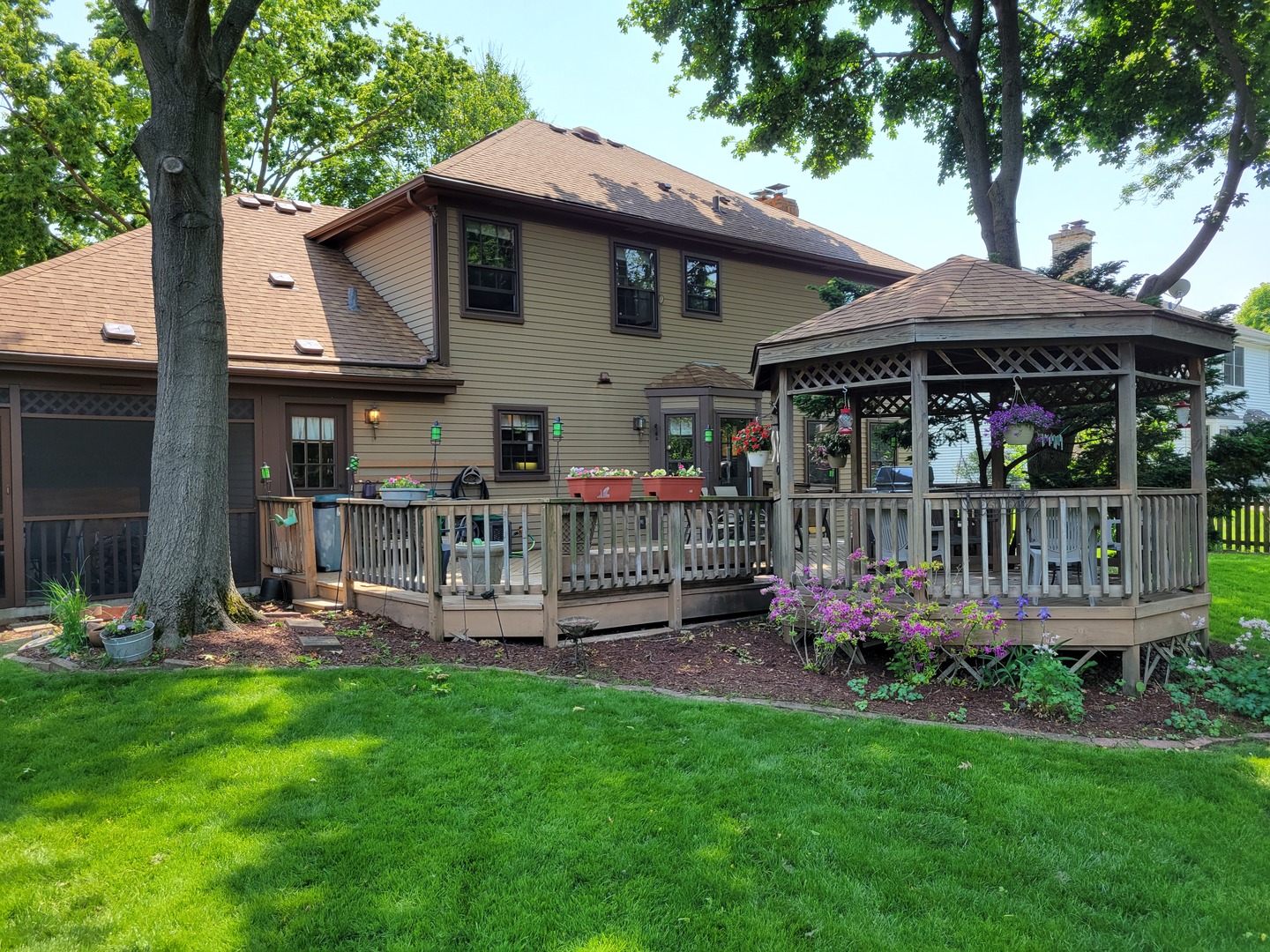1263 Bainbridge Drive Naperville, IL 60563 - Photo 30 of 31 a front view of house with yard and outdoor seating