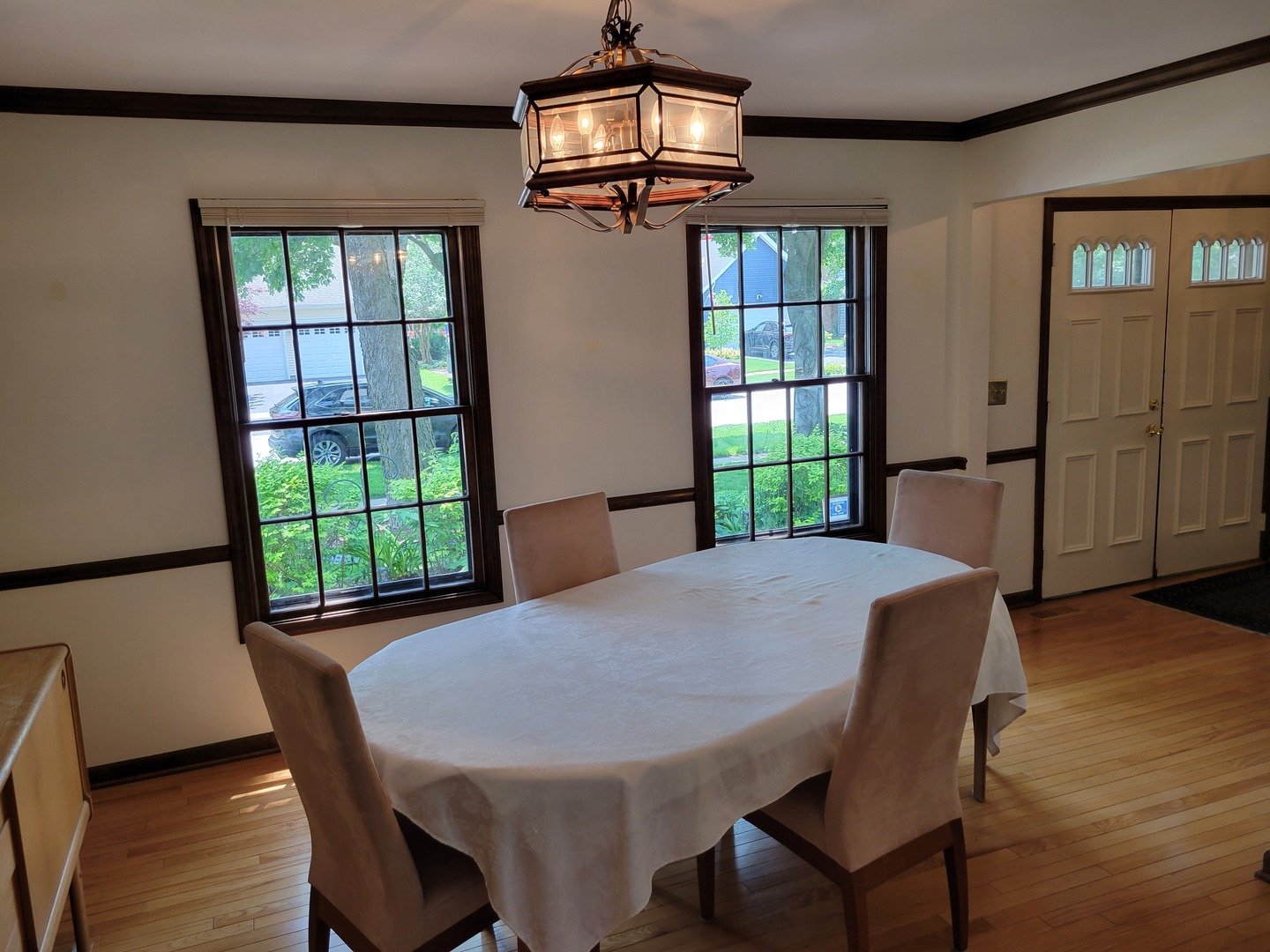1263 Bainbridge Drive Naperville, IL 60563 - Photo 10 of 31 a view of a dining room with furniture window and wooden floor