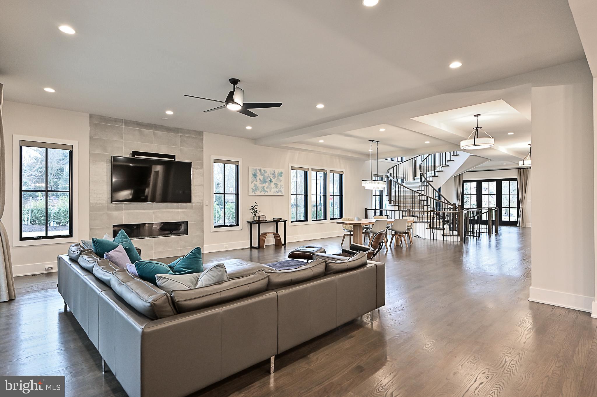 7126 Merrimac Drive McLean, VA 22101 - Photo 32 of 98 a living room with furniture wooden floor and a flat screen tv