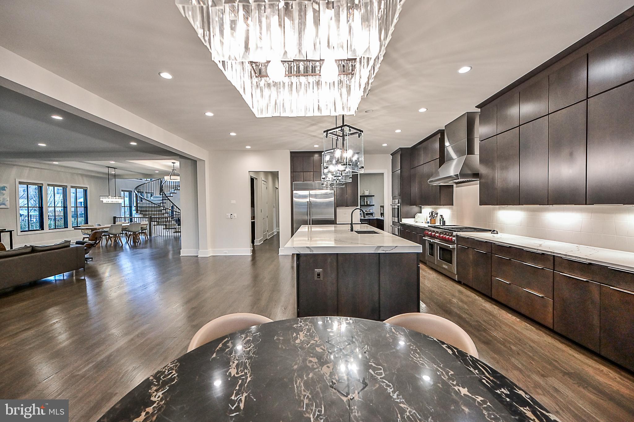 7126 Merrimac Drive McLean, VA 22101 - Photo 38 of 98 a kitchen with a sink stainless steel appliances and living room view