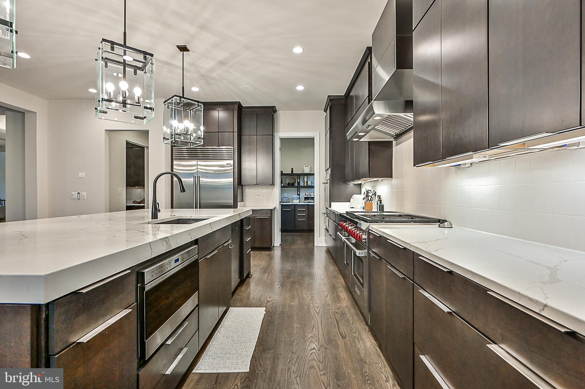 7126 Merrimac Drive McLean, VA 22101 - Photo 40 of 98 a kitchen with stainless steel appliances granite countertop a sink a stove and a refrigerator