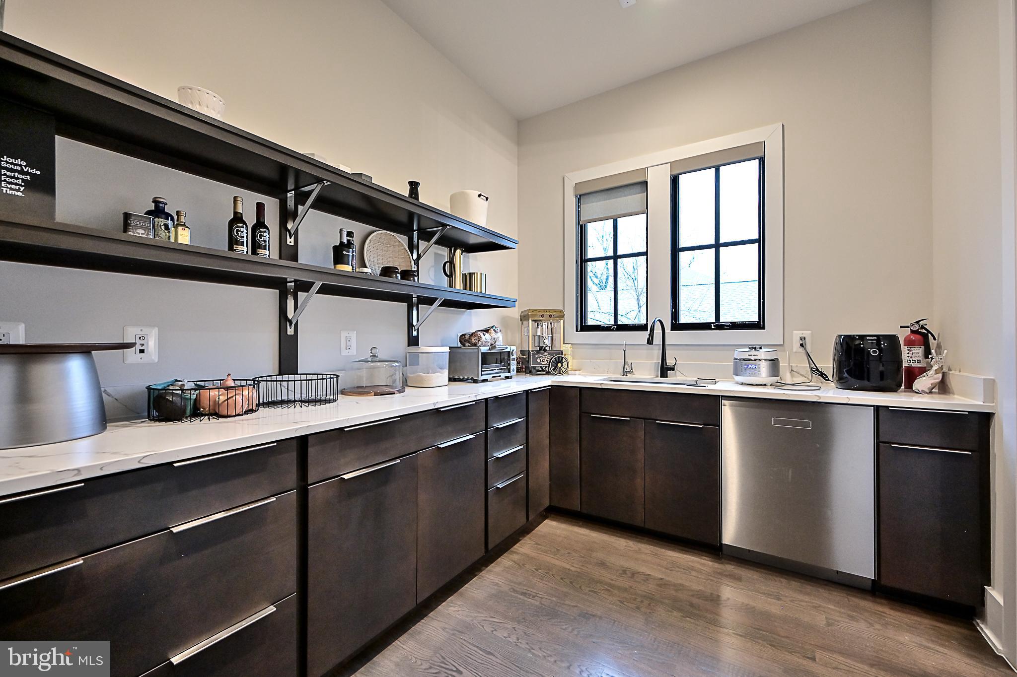 7126 Merrimac Drive McLean, VA 22101 - Photo 44 of 98 a kitchen with cabinets a sink and appliances