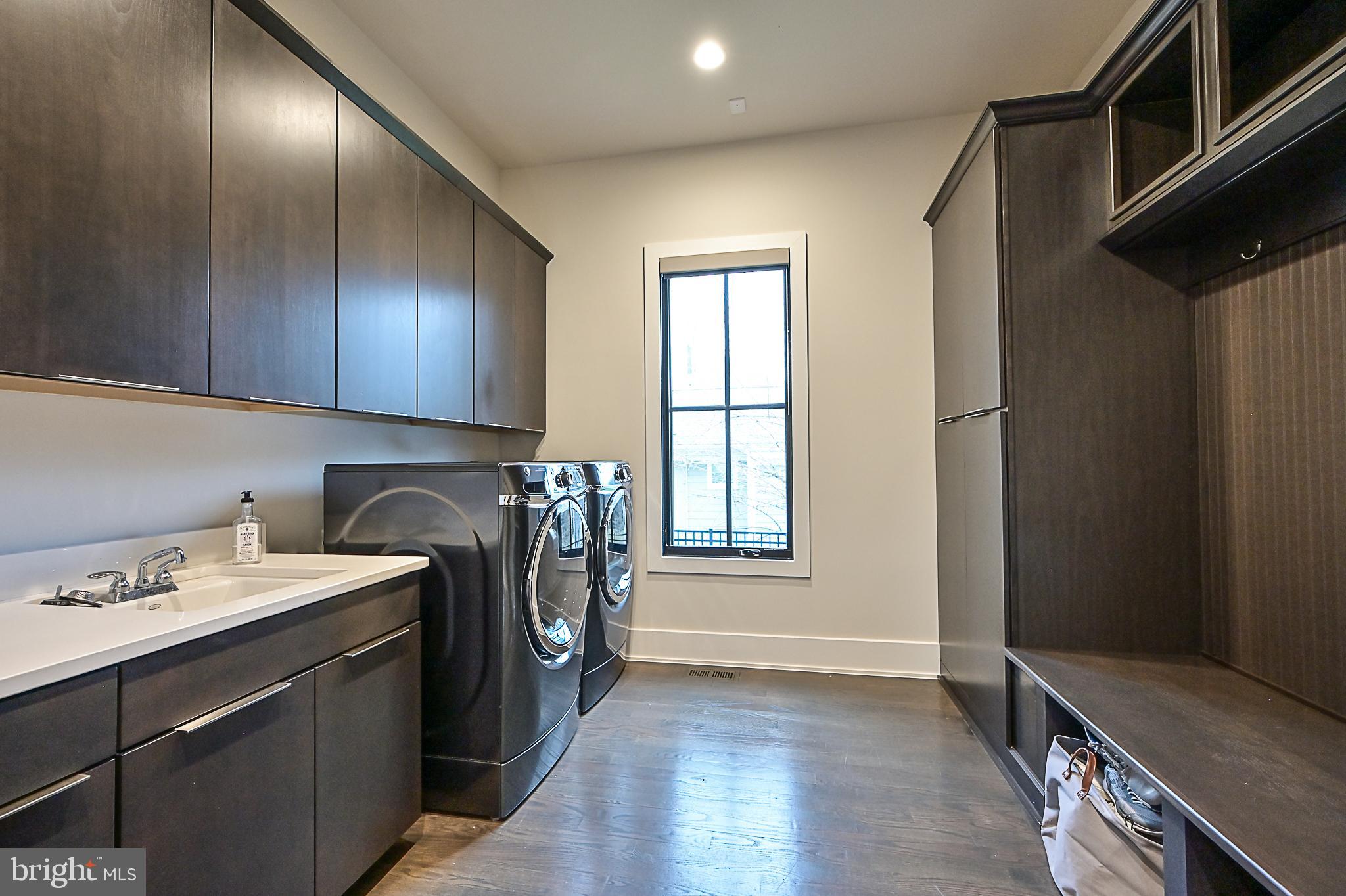 7126 Merrimac Drive McLean, VA 22101 - Photo 50 of 98 a utility room with cabinets dryer and washer